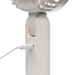 Treva portable fan charging with a white USB cable