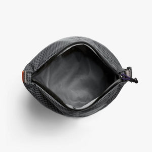 Open interior of a grey Bellroy pouch with a grid pattern