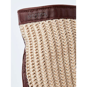 Hestra glove cuff with brown leather trim and beige crochet knit fabric