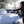 Person using a Zonetech ice scraper to clear snow from a car windshield