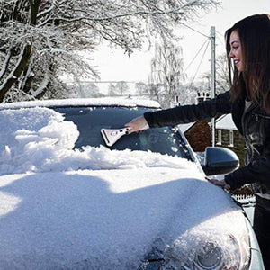 Person using a Zonetech ice scraper to clear snow from a car windshield