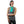Woman wearing a turquoise AlphaCool cooling towel around her neck