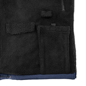 Interior view of black DeWalt fleece vest showing pockets and zipper