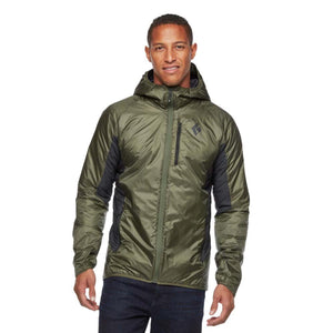 Man wearing an olive green Black Diamond hooded insulated jacket with black side panels