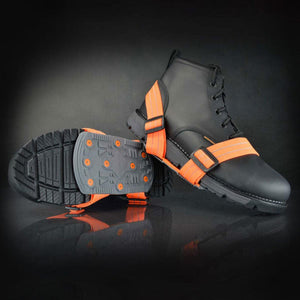 Winter Walking ice cleats with orange straps attached to a black work boot