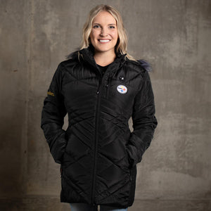 Woman wearing a black ActionHeat Pittsburgh Steelers heated jacket with a faux fur hood