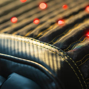 HealthyLine mat surface with carbon fiber texture and glowing red LED lights