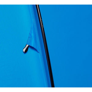 Close up of blue tent fabric with black pole and attachment point