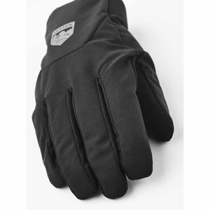 Black Hestra glove with brand logo on the back of the hand