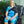 Woman wearing a Polar Products black shoulder cold therapy wrap while sitting in a chair