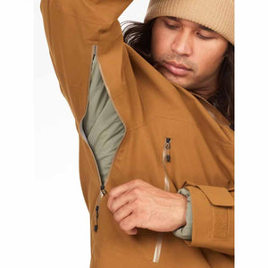 Person wearing a brown Marmot jacket with open pit zips