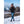 Woman wearing a Mobile Warming black jacket and beanie walking through a snowy landscape