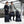 Man and woman standing with various Thule black luggage pieces and backpacks