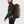 Man wearing a dark green FjallRaven backpack with a waist belt