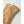 Tan suede gloves with decorative whipstitch detailing on the back