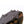 Hillsound traction device with metal spikes attached to a hiking boot sole