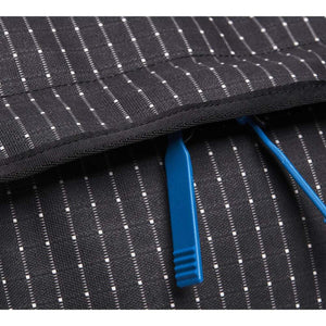 Black Diamond backpack fabric detail with white pinstripes and blue zipper pulls