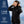 Woman wearing Gobi Heat black heated jacket with 10 hour battery life three heat settings and one year warranty