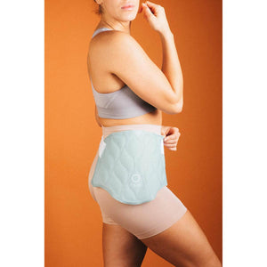 Person wearing a light green Opal quilted wrap around their waist