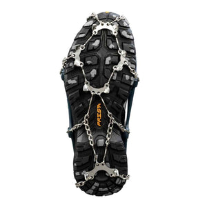 Snowline crampons attached to the sole of a hiking boot