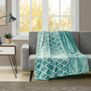Beautyrest teal and white patterned electric throw blanket draped over a grey sofa