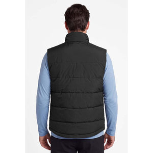 Back view of a person wearing a black Mobile Warming quilted vest over a light blue long sleeve shirt
