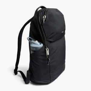 Bellroy black backpack with a CamelBak water bottle in the side pocket