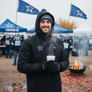 Man wearing ActionHeat jacket and Dallas Cowboys beanie holding a steaming cup at a tailgate