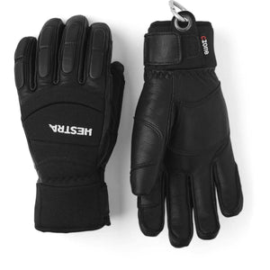 Pair of black Hestra leather ski gloves with velcro wrist straps and carabiner attachment