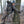 Hunter wearing Heater Body Suit in Mossy Oak camouflage pattern while using a compound bow in a tree stand