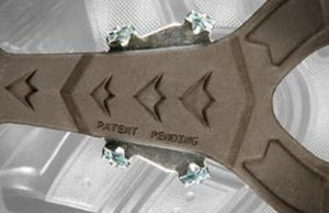 Korkers boot sole traction component with metal studs and patent pending text