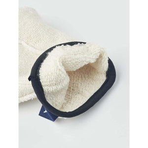 Interior view of a Hestra cream wool glove with black trim