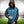 Man wearing a blue and black Detroit Lions hooded varsity jacket