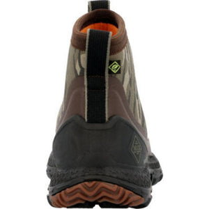 Back view of Muck camouflage ankle boot with black rubber heel and orange tread