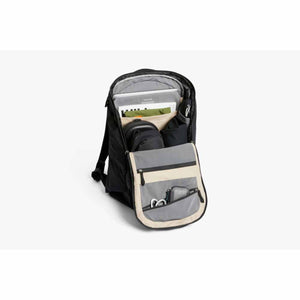 Open Bellroy backpack showing internal organization pockets with laptop and accessories