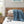 True North by Sleep Philosophy heated blankets stacked on a bed with remote controls