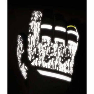Reflective glove with textured pattern against black background