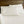 Shavel white bed sheets and pillowcases on a bed with a wooden headboard