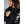 Person wearing a black 8K FlexWarm puffer jacket with a zippered hood