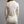 Back view of a Merino Skins cream long sleeve top with a cowl neck
