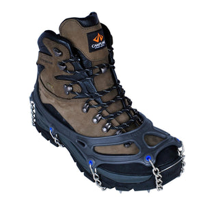 Snowline traction cleats attached to a brown leather hiking boot