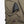 Mobile Warming battery pack connected inside a zippered pocket on olive green fabric