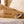 Shield Life tan heating pad with handheld temperature controller on a bed