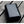 Black portable power bank with 10000mAh capacity on a wooden surface