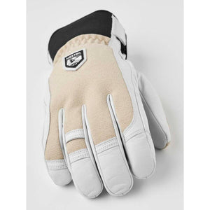 Hestra beige and white leather glove with black cuff and brand logo patch