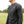 Man wearing a black Volt long sleeve base layer shirt with grey contrast stitching