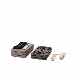 Snow Peak folded camping furniture components including table parts and storage bag