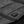 Black Racer branded power button on quilted fabric