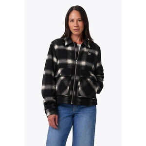 Mobile Warming black and white plaid zip up jacket with front pockets worn by a woman