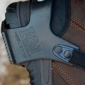 K1 Heelstop traction device attached to a brown leather work boot